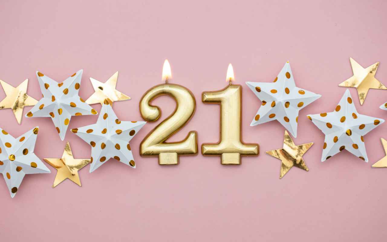21st Birthday banner with stars and the number 21 as candles