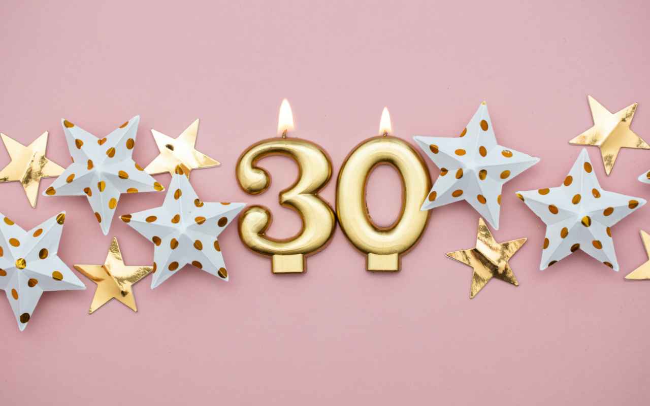 30th birthday banner with stars and the number 30 as candles