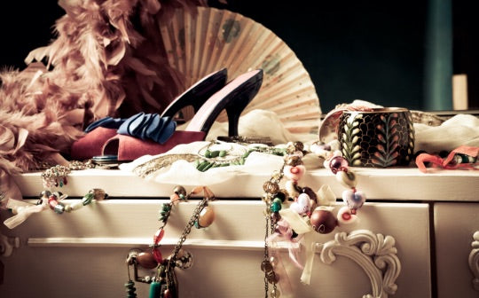 Assortment of women's fashion accessories on a console