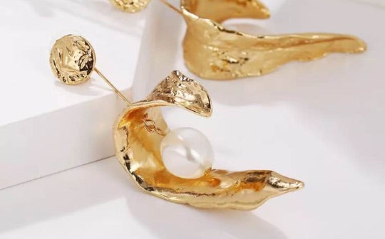 Sculptured gold curled leaf earrings with pearl inset