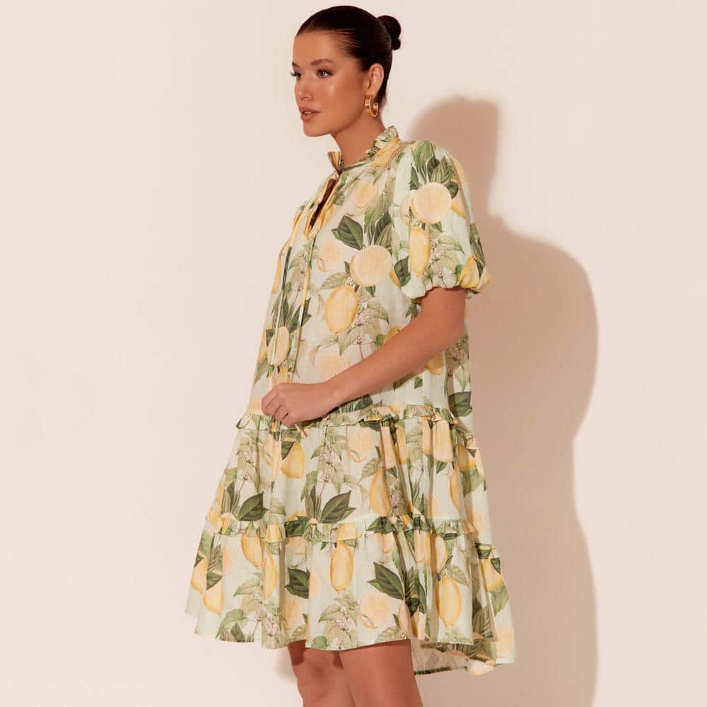      V-neck with tie     Frilled neck     Short, elasticised puff sleeves     Tiered, with frill detail     Lemon print     Easy, relaxed fit     Materials: 100% Linen