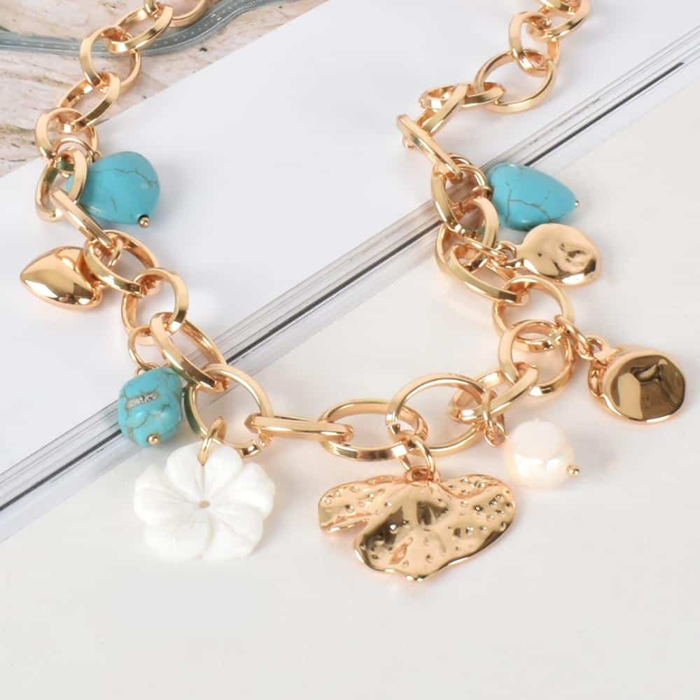 Charming Mixed Necklace Round hinge clasp closure Mixed charm drop detail Fresh water pearl charm Stone charm detail Chunky gold chain