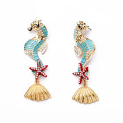 Gold and enamel sea horse dangle earrings with diamante