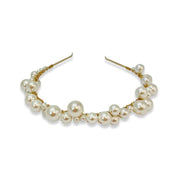 Gold alloy headband adorned in various sized pearls