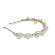 Gold alloy headband adorned in various sized pearls