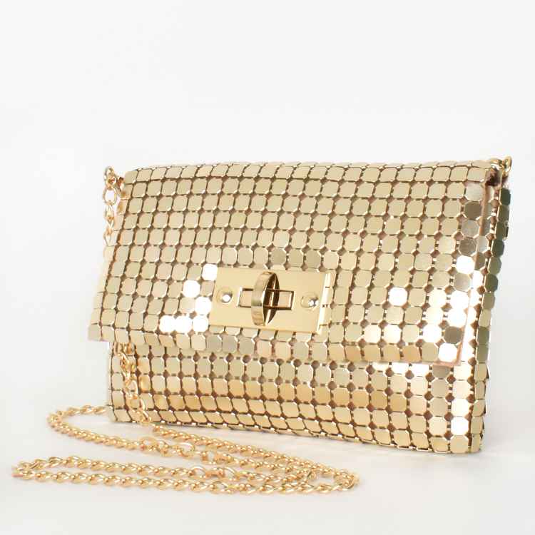 Gold metal mesh bag Gold removable chain strap Toggle front closure Lined in gold satin Internal pocket