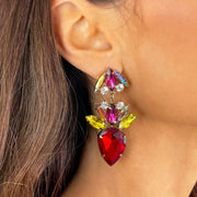 Close up of model wearing Colourful rhinestones and diamante set in gold alloy with red rhinestone drop