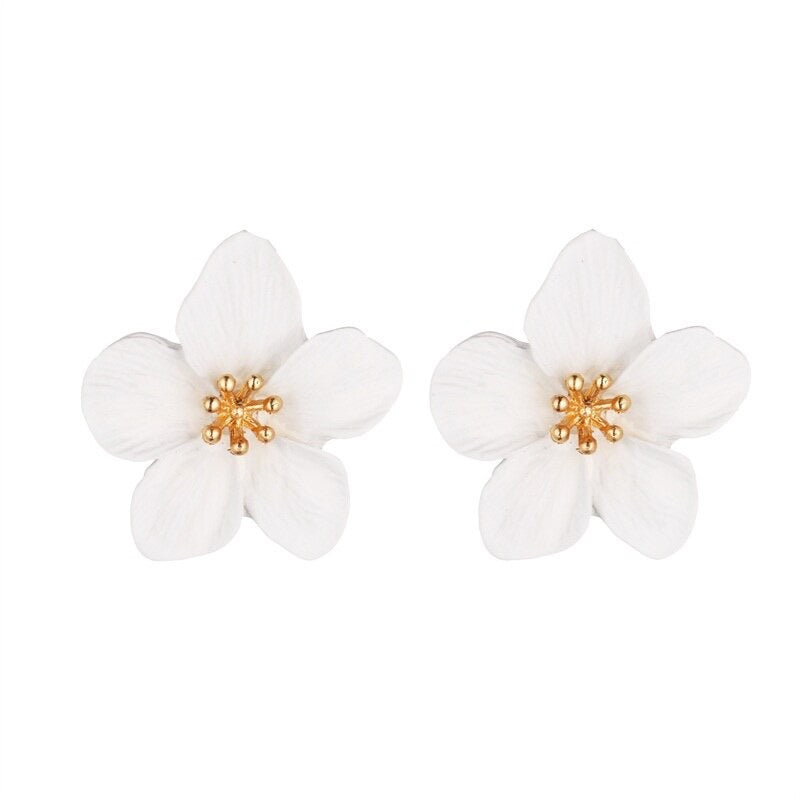 White  flower stud earrings with gold allow centre