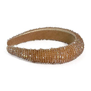 Crystal covered headband Satin padded fabric Available in champagne, steel and white Width 3.5 cm, Height 1.5 cm in Champagne