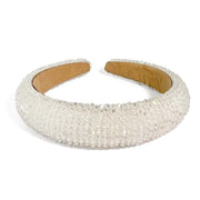 Crystal covered headband Satin padded fabric Available in champagne, steel and white Width 3.5 cm, Height 1.5 cm in White