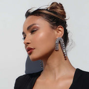 Diamante Silver Curve Drop Statement Earrings on Model