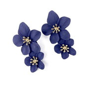 Purple double bloom flower drop statement earrings with gold centre