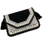Black canvas flap over clutch with Mixed metallic beading and Black faux suede tassels plus a Magnetic closure
