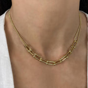     18k gold plated stainless steel necklace     Double strand and geometric detailing     Length38 cm plus 5.5 cm extension on Model