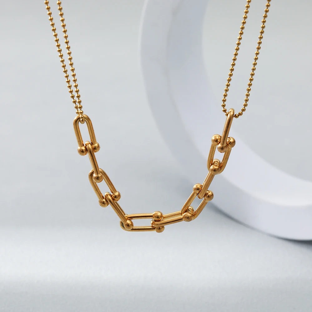     18k gold plated stainless steel necklace     Double strand and geometric detailing     Length38 cm plus 5.5 cm extension