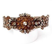 Front view of Velvet fabric headband Richly embellished with champagne beige ab rhinestones and diamante with Floral design