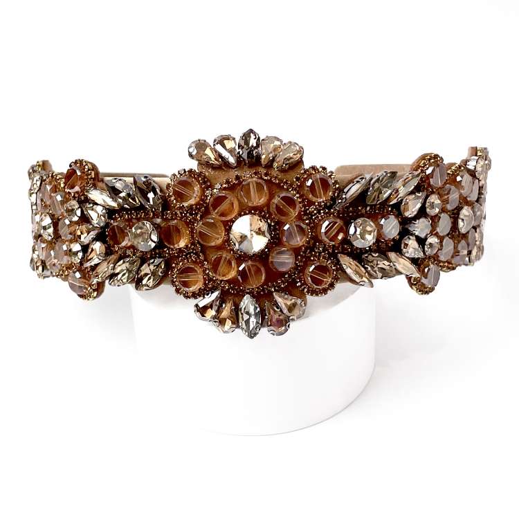 Front view of Velvet fabric headband Richly embellished with champagne beige ab rhinestones and diamante with Floral design