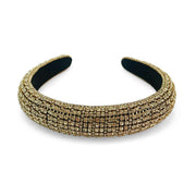 Black velvet padded headband covered in gold diamante