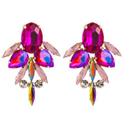 Close up of Geometric design Rose coloured Rhinestone and diamante Earrings Set in gold alloy