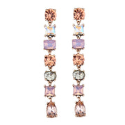 Long varied diamante earrings in blush colour set in vintage gold alloy