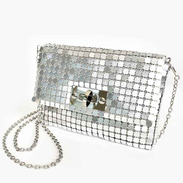 Silver metal mesh bag silver removable chain strap Toggle front closure Lined in gold satin Internal pocket