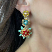 Gold flower stud with pearl detail Colourful tiered flower drops on Model