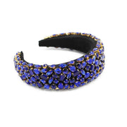 Black padded headband encrusted in striking blue rhinestones  Edit alt text
