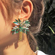 arge Palm Tree Rhinestone and Diamante Statement Earrings on model up close