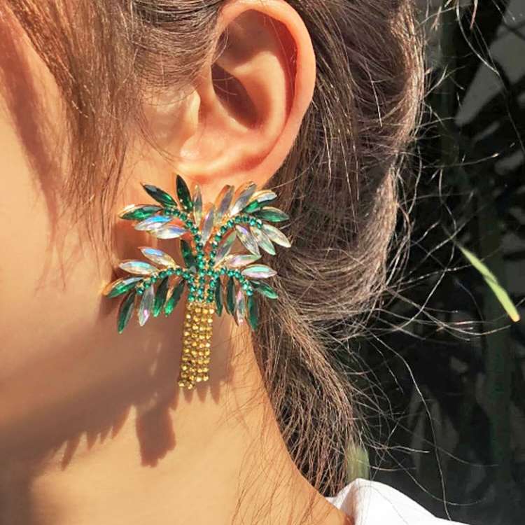 arge Palm Tree Rhinestone and Diamante Statement Earrings on model up close